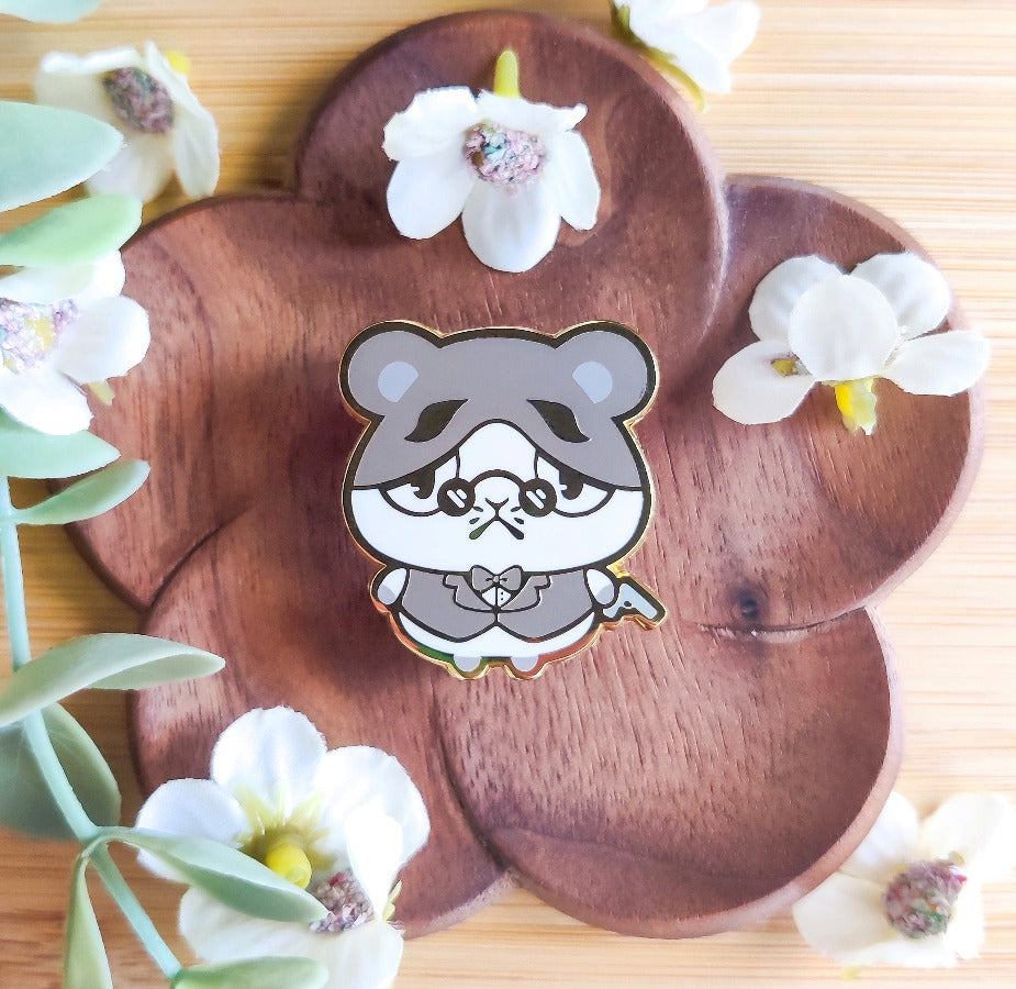 Cute enamel pin featuring the squishy mafia hamster Marlo!